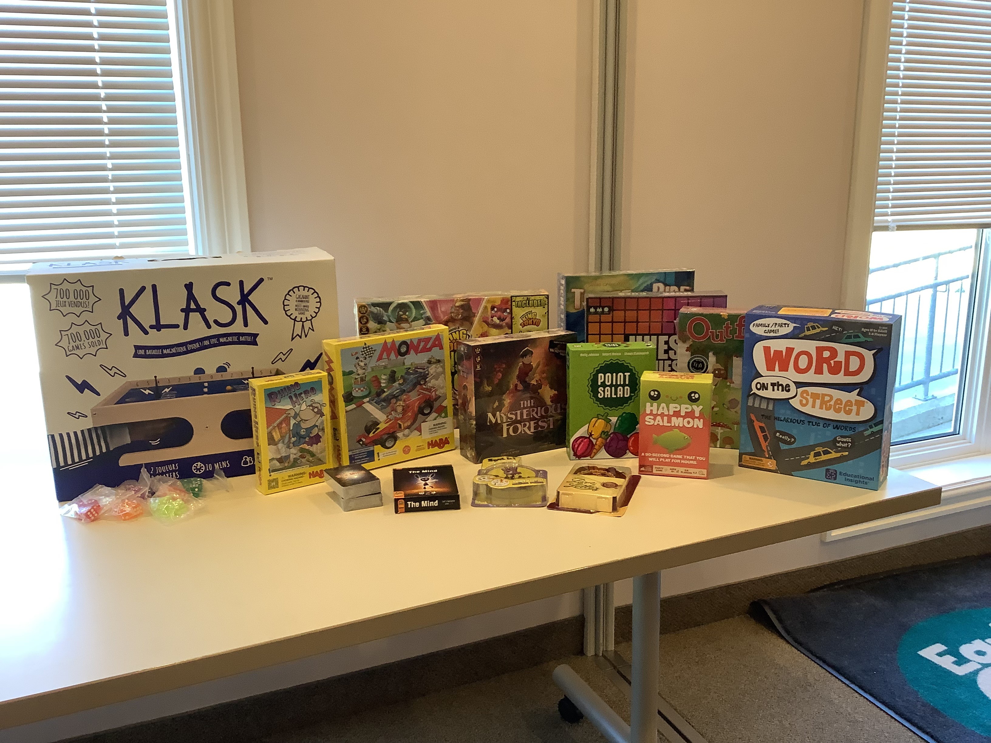A collection of board games displayed on a table.